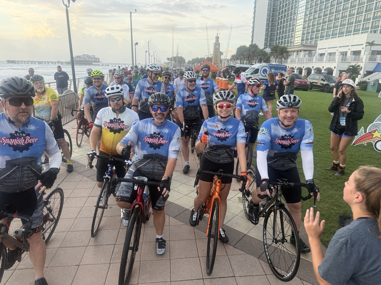 Team Spanish Beer cyclists at Bike MS event - group photo at waterfront with matching team jerseys